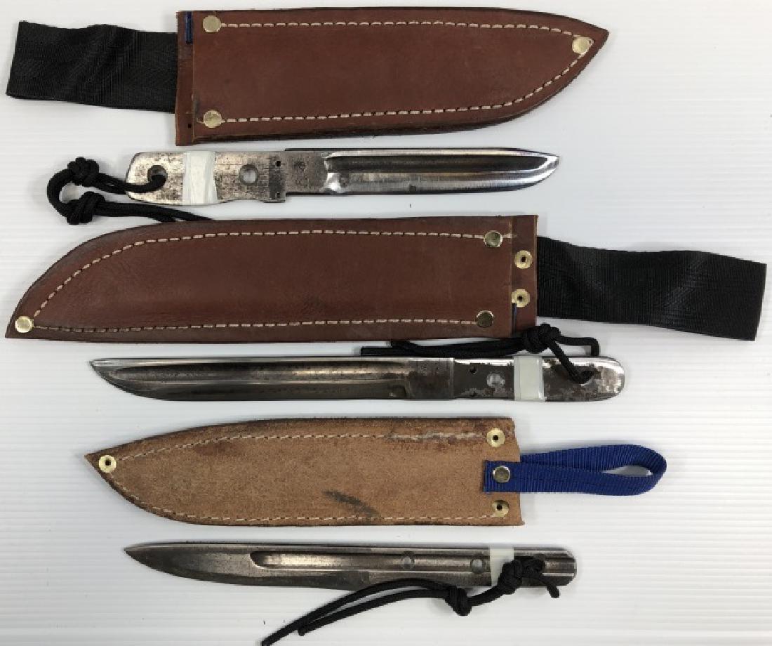 *3 HANDMADE THROWING KNIVES: All with leather sheaths.