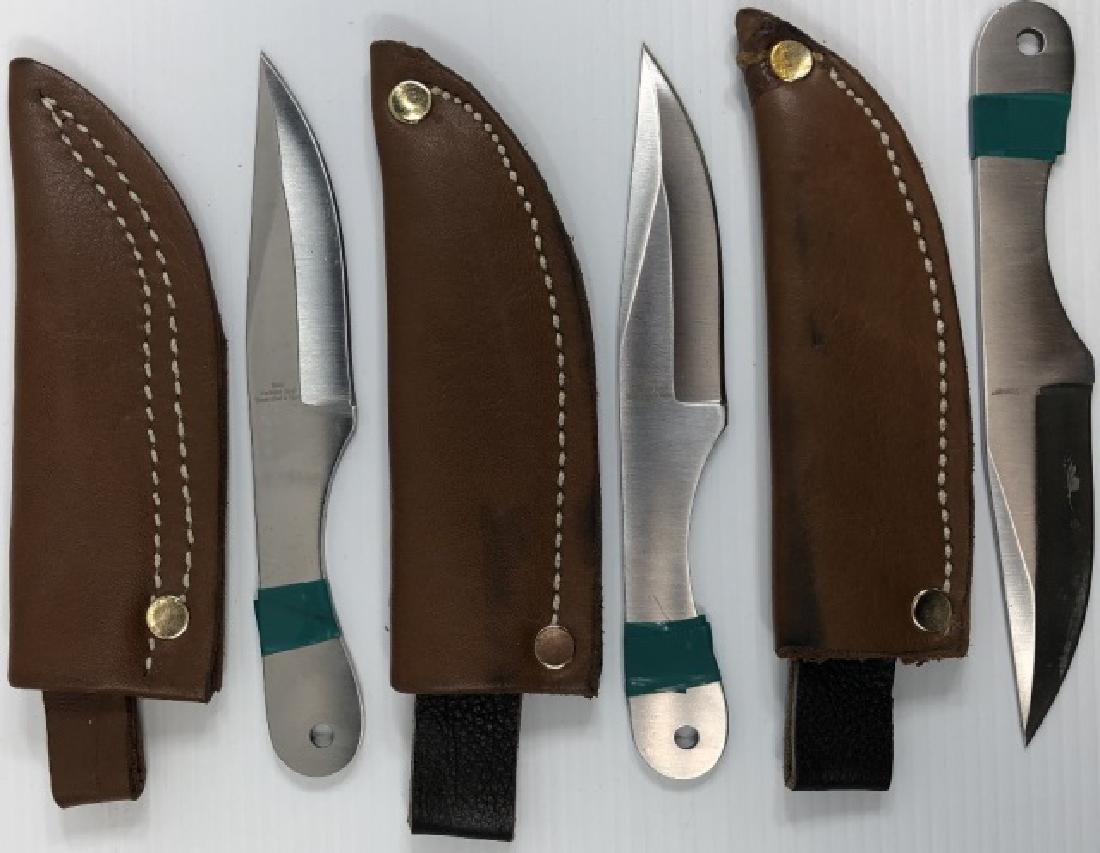 *3 THROWING KNIVES: All marked "Ridge Runner", all with leather sheaths.