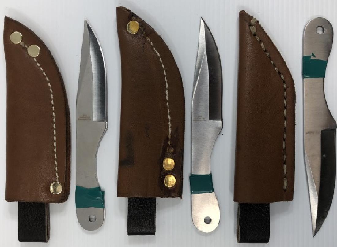 *3 THROWING KNIVES: All marked "Ridge Runner", all with leather sheaths.