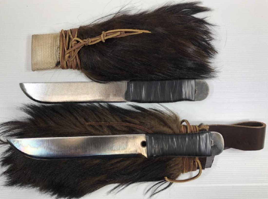 *2 LARGE HANDMADE THROWING KNIVES: With leather and fur sheaths.