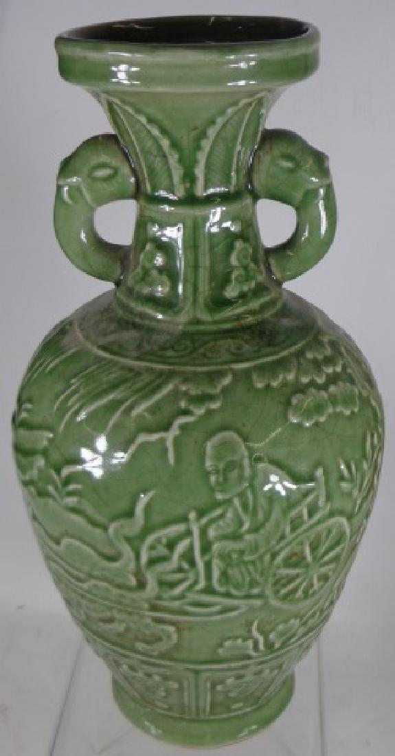 *CHINESE POTTERY VASE: Having green ground decoration with 2 handles depicting elephant trunks, one side depicting old man in cart pulled by two animals, other side depicting figure on horse, approximate diameter 14 1/2".