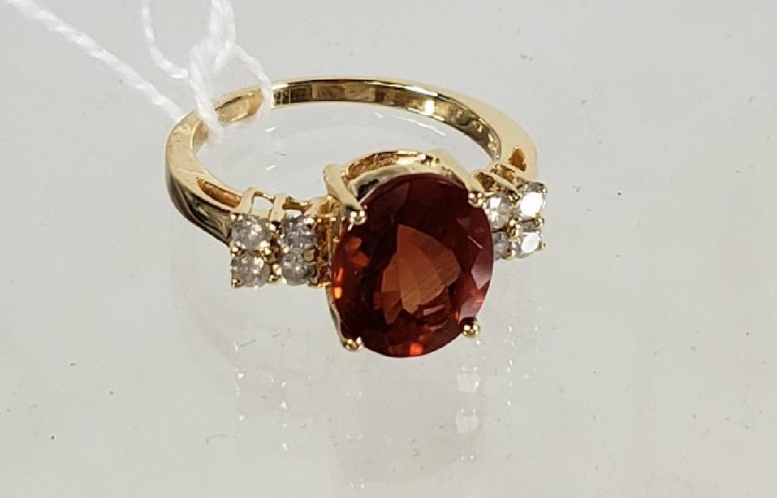 *LADIES' 14K GOLD RING: Having labradorite center stone and 8 small diamonds, approximate ring size 7.