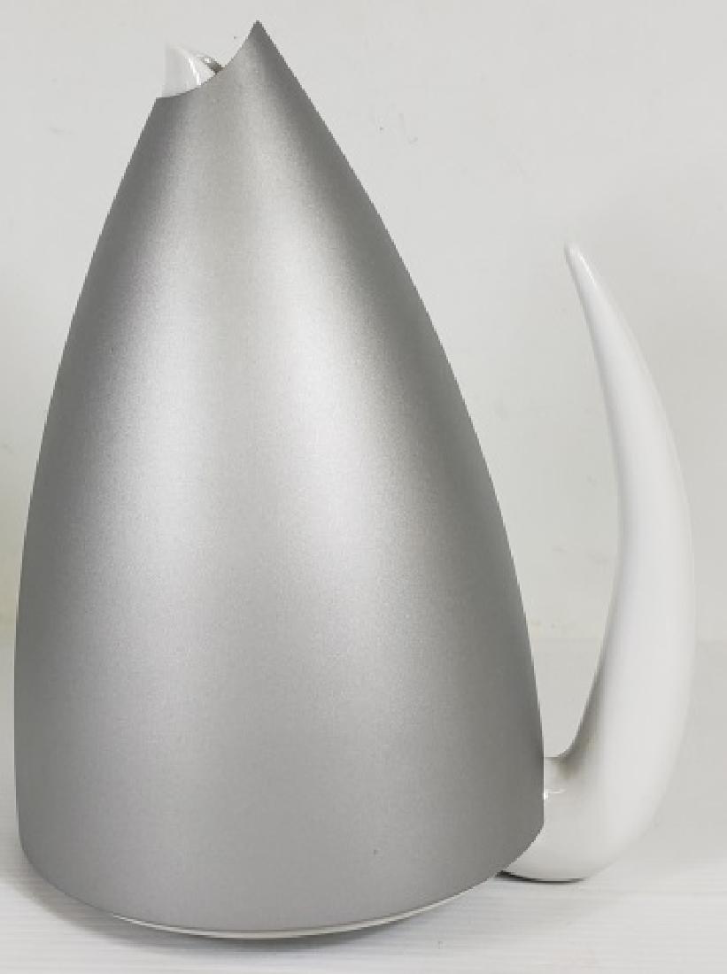 *PHILIPPE STARCK TI-TANG TEAPOT: Marked on bottom "Alessi Tendentse, Germany", porcelain and aluminum, complete with porcelain teapot, aluminum cover, and internal strainer, approximate height 8 3/4", length 6 7/8", depth 5 1/2".