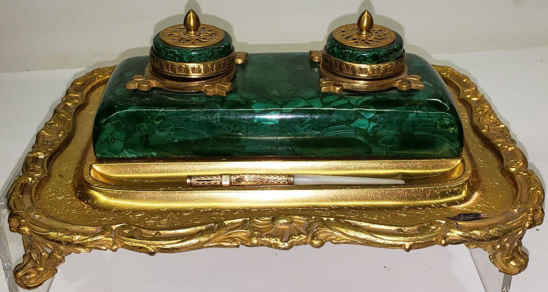 *DESK TRAY: Having 2 inkwells, raised on malachite form and brass base, approximate width 11 3/4".