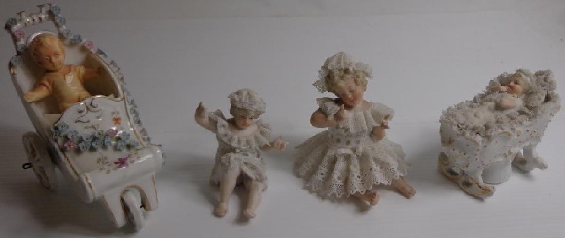 *4 GERMAN PORCELAIN FIGURES: Cradle with baby, 2 young seated girls, etc.
