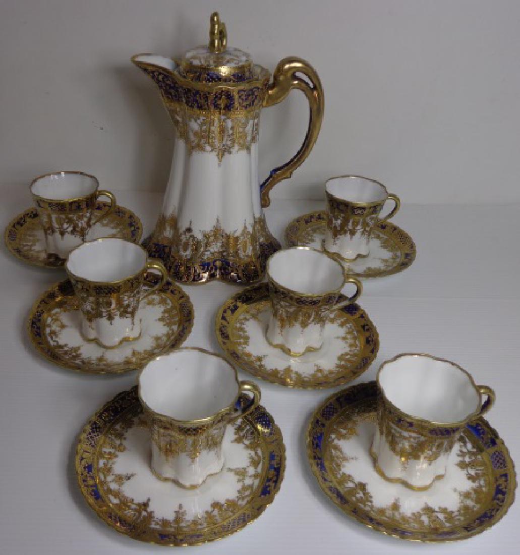 *13-PIECE NIPPON CHOCOLATE SET: Having cobalt and gilt decoration, 6 cups, 6 saucers, and chocolate pot.