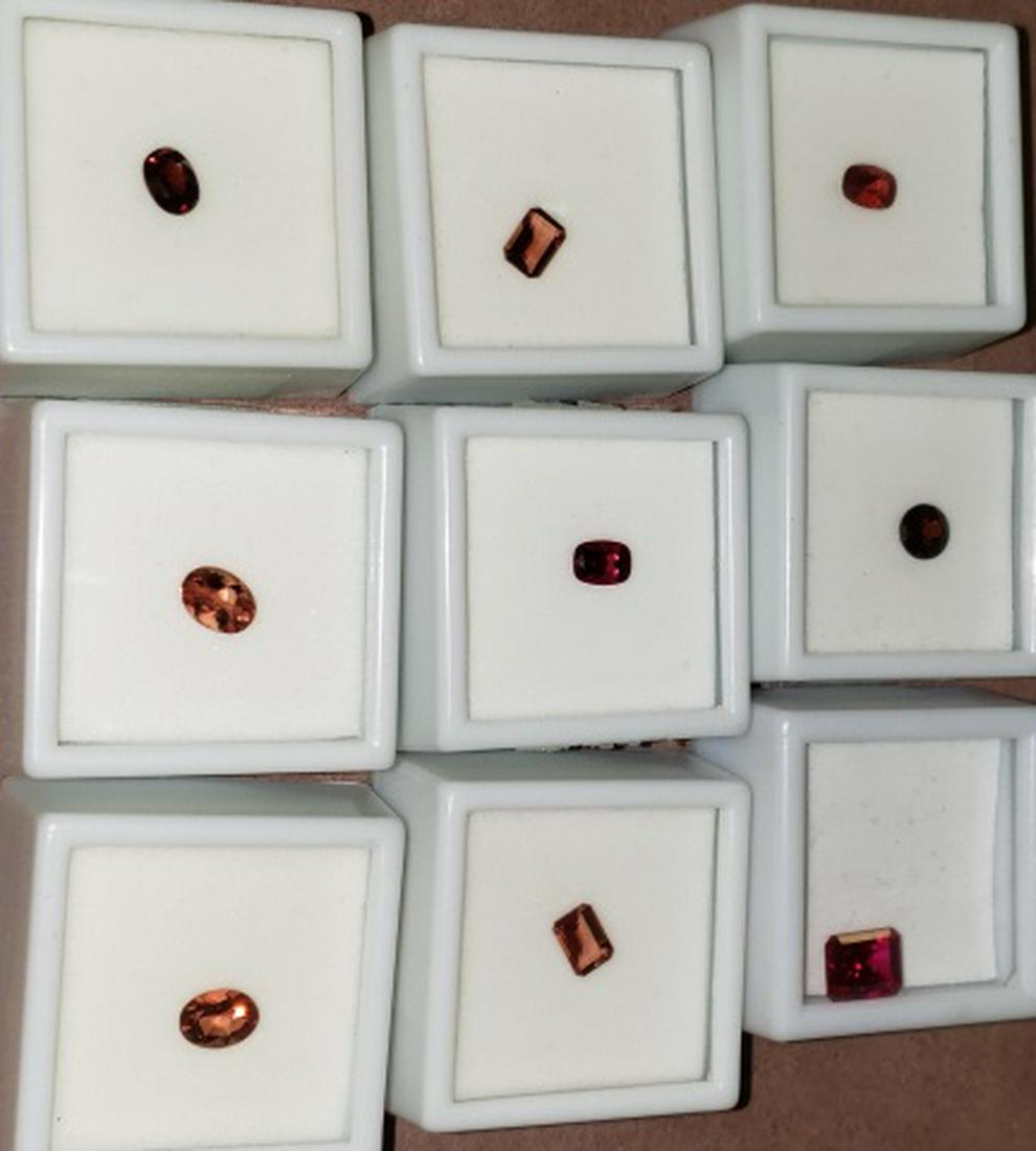 *9 SEMI-PRECIOUS GEMS: .65 carat red labradorite, .95 carat labradorite, .65 carat red labradorite, .70 carat rubellite, 1.30 carat red zircon, .3.50 carat lab created ruby, .95 carat labradorite, .70 carat red spinel, .65