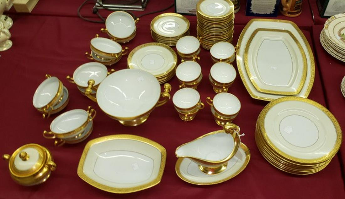 *PARTIAL SET OF HUTSCHENREUTHER DINNERWARE: 8 service plates, 12 cups, 23 saucers, 10 bullion cups, 7 bullion cup saucers, 6 salad plates, sauceboat with attached underdish, 2 serving trays, serving bowl, circular bowl fitted with 2 handles, an