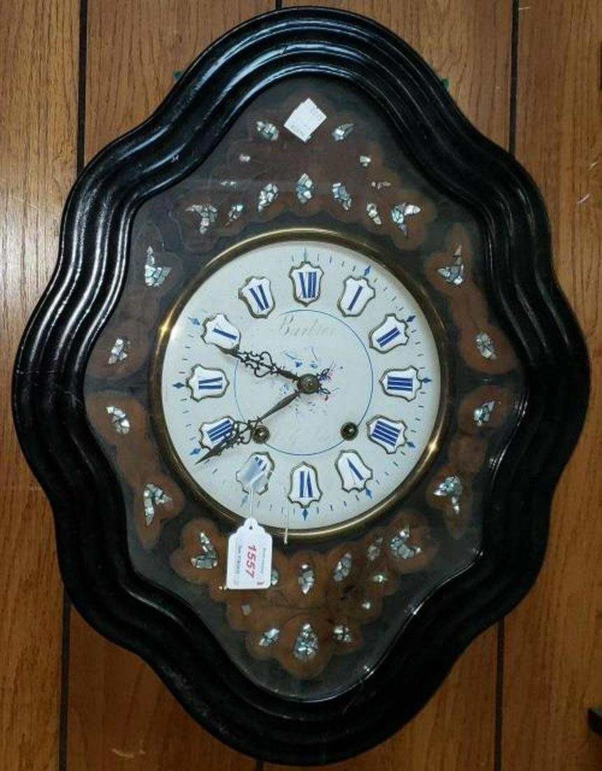 *FRENCH WALL CLOCK: Fitted with time and strike movement, enamel dial having Roman numeral markers, enclosed in case decorated with mother-of-pearl inlay and having ebony finish.