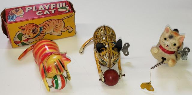 3 WIND-UP CAT TOYS: 2 tin, 1 marked Marx and the other marked "Made in Japan", with original box, and 1 plastic wind-up toy, cat chasing butterfly, marked "Made in Occupied Japan".