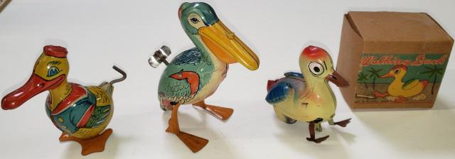 3 TIN WIND-UP TOYS: 2 J. Chein, duck, marked Chein, and pelican, unmarked, and 1 duck, marked "Made in Occupied Japan", with original box.