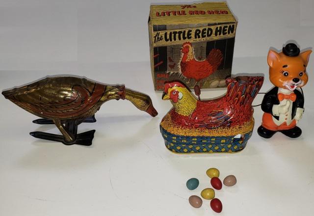 3 WIND-UP TOYS: 1 Louis Marx tin feeding goose, 1 Baldwin tin Little Red Hen, "She Cackles, Lays Eggs", with original box and eggs, and 1 plastic cat.
