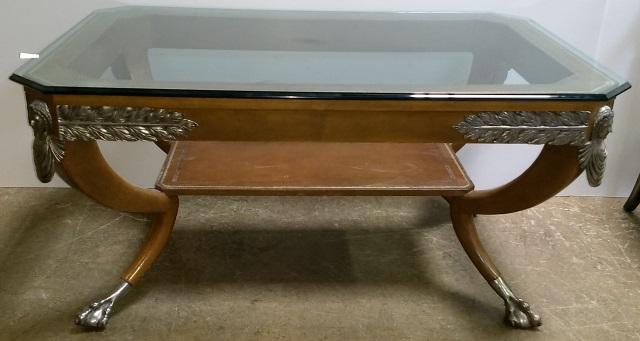 EMPIRE STYLE COFFEE TABLE: Having plate glass top with canted corners, raised on conforming base, sabre legs joined with platform stretcher and ending in lion paw feet.