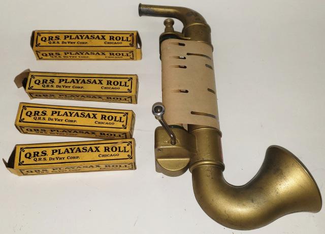 TOY SAXOPHONE: Q.R.S. Playasax by Q.R.S. DeVry Corp., comes with extra Playasax rolls.