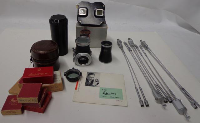 *GROUP OF PHOTOGRAPHY ITEMS: 5 double cable releases, 8 Leica filter boxes, Sawyer Viewmaster in original box, Leica leather lens case, 2 parts to Leitz circular mirror box, Bakelite Leica case for 13.5cm Hektor, and instructiona