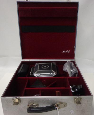 GROUP OF PHOTOGRAPHY EQUIPMENT: Linof Technika 4x5 view camera (S/N: 8481454), housed in aluminum aircraft case, with front lens board, 45-degree finder, Super Rollex 58 x 72mm film back, viewfinder, etc.