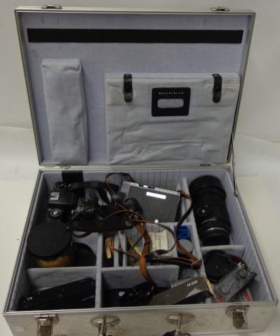 GROUP OF PHOTOGRAPHY EQUIPMENT: Lika R4 MOT 35mm camera (S/N: 1536226), Leitz Canada Summicron-R F2 50mm lens (S/N: 2925582), 2 motors, battery pack, 180mm Elmarit-R 2.8 lens, camera straps, lens caps, filters, lens case, etc.