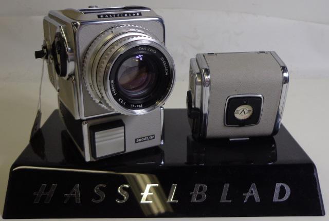 GROUP OF PHOTOGRAPHY EQUIPMENT: Hasselblad 500EL-M motordrive camera body 1962-1982 20 Years in Space special model no. 0945 (S/N: RH1322818), A24 magazine, no viewfinder, additional A16 magazine (S/N: RC3284092), Zeiss Planar 80mm