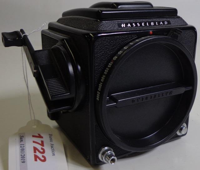 GROUP OF PHOTOGRAPHY EQUIPMENT: Hasselblad FC200 camera body (S/N: RS1514009), Polaroid back 100.