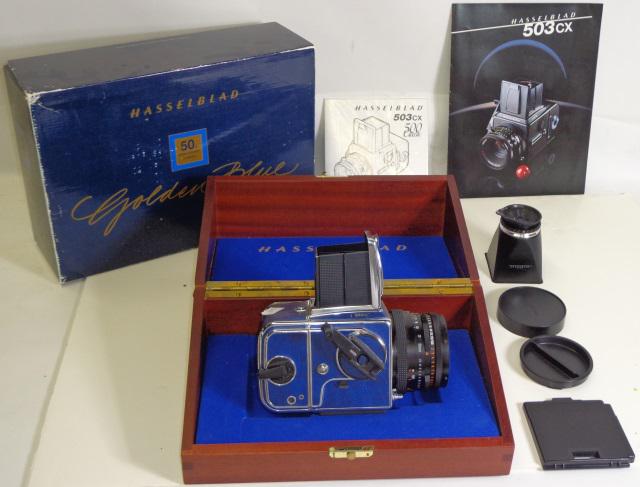 GROUP OF PHOTOGRAPHY EQUIPMENT: Hasselblad Golden Blue 50th Anniversary camera in box, with gold plaque, 503CX body (S/N: 11EP23909), CF lens, A24 magazine (S/N: 32EP15669), 80mm Zeiss F2.8 Planar lens (S/N:6672727), camera strap, f