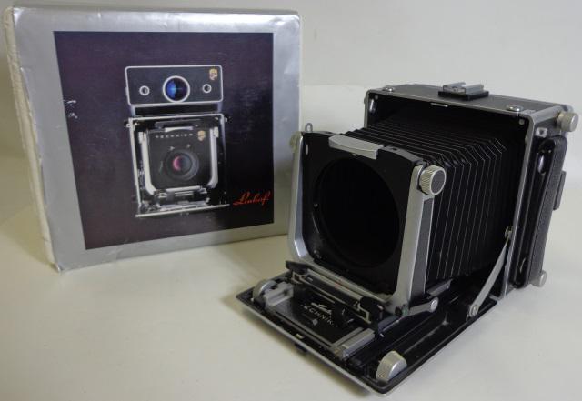 GROUP OF PHOTOGRAPHY EQUIPMENT: Master Technika 2000 4x5 press-style view camera (S/N: CS41112), no lens, WISTA lens board, 4x5 view back, comes with box and original instructional booklets.