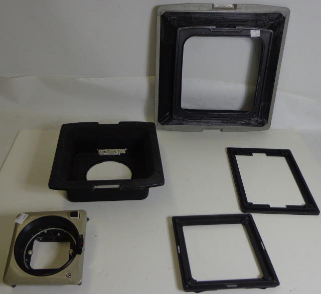 GROUP OF PHOTOGRAPHY PARTS: 5 piece for a rail-mounted camera including Linhof front plate, stanchion piece with bellows, 12 x 12 dimension, etc.