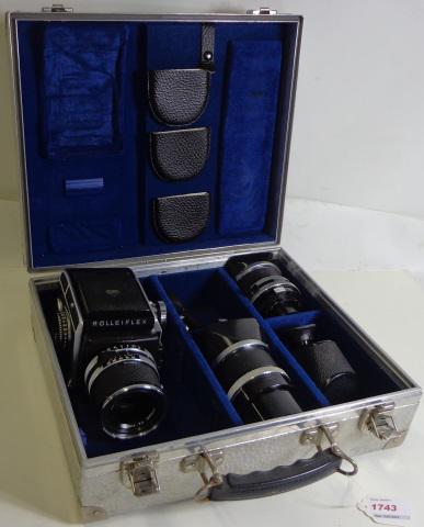 ROLLEIFLEX MODEL SL66 CAMERA: Rolleiflex SL66 2.25 x 2.25 camera, (S/N: 2906921), has Zeiss distagon 80mm F4 lens, (S/N: 4956804), Zeiss Sonnar 150mm F4 lens, (S/N: 495687), encased in aircraft case.