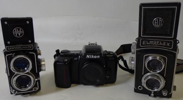 *3 CAMERAS: 1 Elmoflex camera, with Olympus Zuiko 75mm F35 lens and Seikosha-Rapid shutter, 1 Sawyer MKIV camera, with Topcor 6cm F2.8 lens, and 1 Nikon 35mm M6006 camera, (S/N: 3193612), camera case and strap.