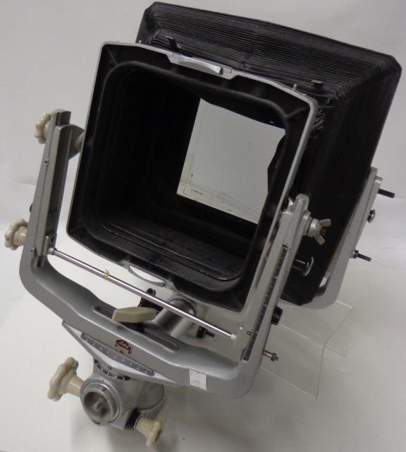 PAIR OF LINHOF STANCHIONS: Front stanchion supporting 11x14 bellows, back stanchion supporting the back end.