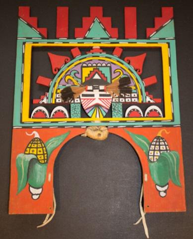*HOPI TABLITA: Hopi Salako kachina face with corn on front and flowers on back, having feathers, including leather strings, 1960, approximate height 14 1/8", width 11", depth 1/2".