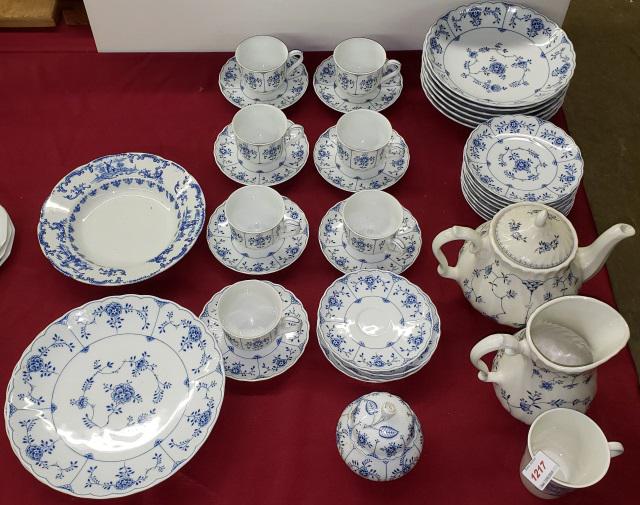 SET OF TIRSCHENREUTH DINNERWARE: 6 bowls, 8 bread plates, 7 cups, 11 saucers, pitcher, covered sugar, coffee server, 3 shallow bowls, and Wedgwood mug.
