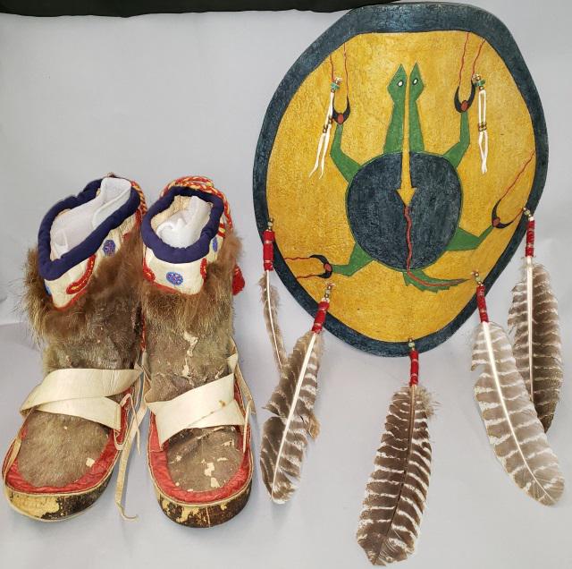 *2 NATIVE AMERICAN PIECES: Pair of mukluks and rawhide turtle shield by Butch Thunderhawk.
