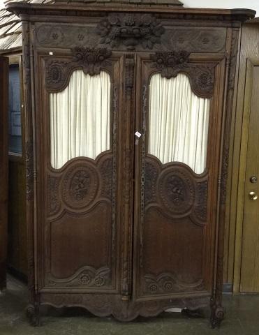 19TH C. FRENCH OAK ARMOIRE: Having carved fruit and floral decoration, flat molded cornice over 2 doors, approximate height 91 1/2", width 57 1/2", depth 20".