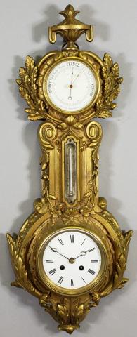 *GILT BRONZE WALL CLOCK AND BAROMETER: Having gilt scroll, flora, and leaf decoration, fitted with time and strike movement, comes with key, approximate height 26".
