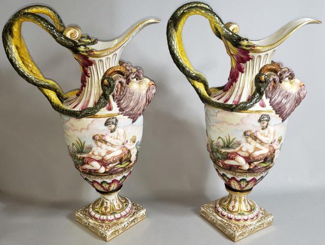 PAIR OF CAPODIMONTE EWERS: Having ram's head and classical figures decoration, approximate height 20 1/2".