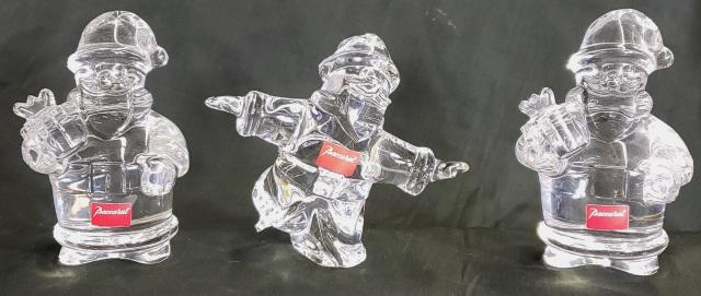 *3 BACCARAT CRYSTAL FIGURES: 2 Santas with presents, approximate height 4 3/8", and 1 ice skating Santa, height 4".