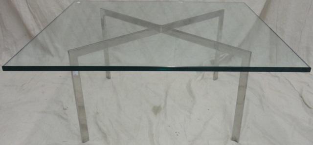 *BARCELONA STYLE COFFEE TABLE: In the manner of Knoll Mies Van der Rohe, having glass top and chrome base, approximate height 17", width 40", depth 40".