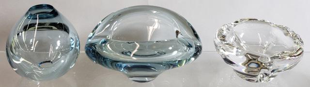 3 PIECES OF SWEDISH ART GLASS: Light blue vase (diameter 3 1/2") and two ash receivers. One light blue (length 5 3/4") and the other clearmarked Daum France (4 1/4)