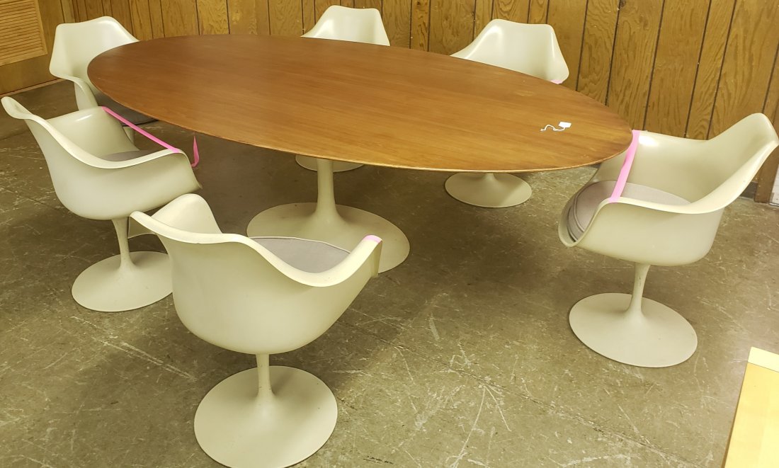 *AERO SAARINEN FOR KNOLL TULIP TABLE & CHAIRS: 7-piece set, having table with teak top and tulip base, approximate height 28 3/4", width 54", depth 96", and 6 swivel tulip armchairs, there are labels on all chairs and table.