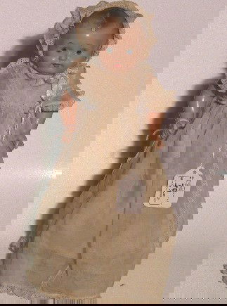 EFFANBEE DAINTY BABY COMPOSITION DOLL| Having paint: EFFANBEE DAINTY BABY COMPOSITION DOLL| Having painted features, painted molded hair, on composition and cloth body, marked on back Effanbee Dainty Baby Dolls, approximate height 10''. CONDITION: Good,