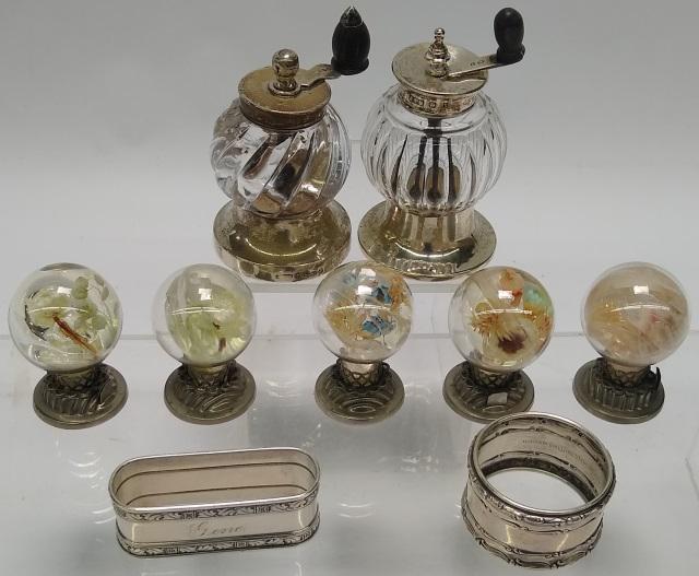 *9 PIECES OF STERLING SILVER: 2 pepper mills, approximate height 3 1/2", 5 place card holders, height 2 1/4", and 2 napkin rings, diameter 2 3/4" and other ring width 2", both engraved "Gene".