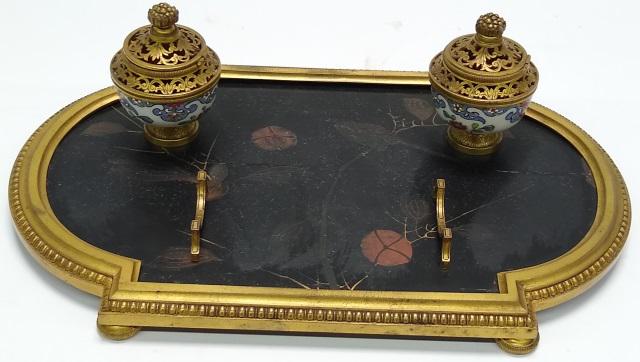 *PEN TRAY: Having 2 brass ink bottle holders (no glass inserts), raised on ebony-finish base with gilt borders, height 3 5/8", width 12 7/8", depth 8 1/8".