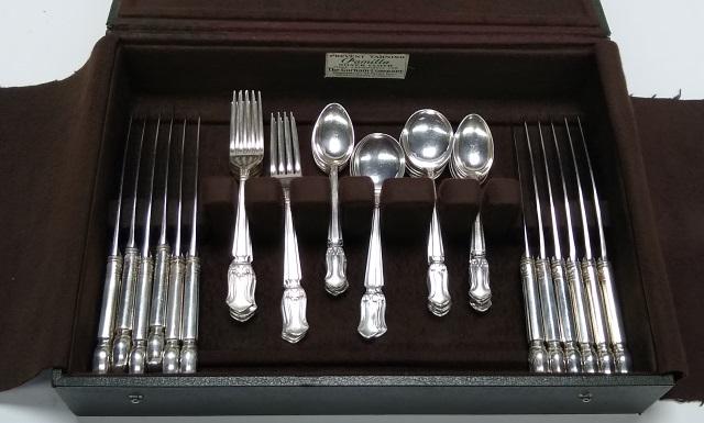 *48-PIECE SET OF STERLING SILVER FLATWARE: 12 dinner knives, 12 dinner forks, 12 teaspoons, and 12 bullion spoons.