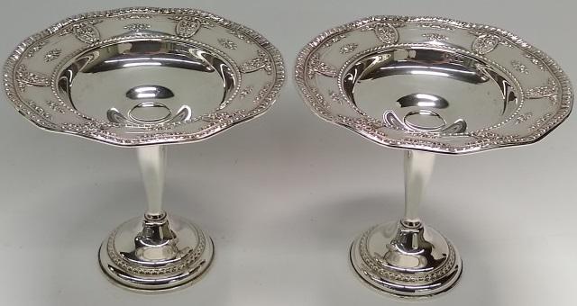 *PAIR OF STERLING SILVER COMPOTES: Having weighted base, approximate height 6 1/4".