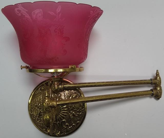 *VICTORIAN WALL SCONCE: Having brass frame, etched cranberry glass shade decorated with classical beauty, with folding extension.