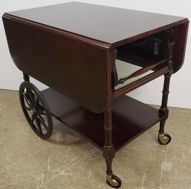 *BAKER TEA TABLE: Having drop leaves and fitted with single drawer, approximate height 28 3/4", width 19" closed and 42 1/2" open.