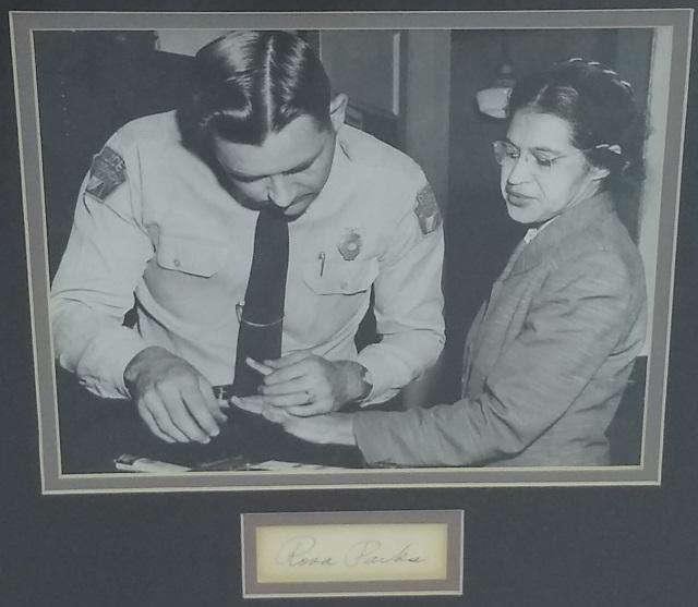 *ROSA PARKS AUTOGRAPH: Professionally double matted and framed with b/w photo, 9 1/2" x 7 1/2", of Parks being fingerprinted in Montgomery, Alabama, Dec. 1, 1955, and 3" x 1 1/4" autograph. Signature, Rosa Parks, Rosa Louis