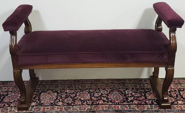 *PERIOD STYLE BENCH: Having purple upholstered armrests and seat, approximate height 26", width 44", depth 18".
