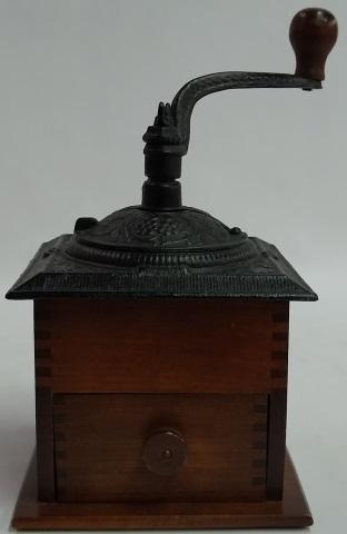 *TABLE-TOP COFFEE GRINDER: Having iron top with wood base.