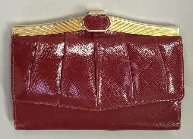 *JUDITH LEIBER WOMAN'S WALLET: Judith Leiber red leather woman's wallet. Provenance: Personal property from the estate of Uta DeTappan-Staley.